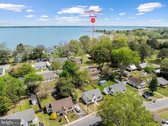 aerial view of residential area with a nearby body of water