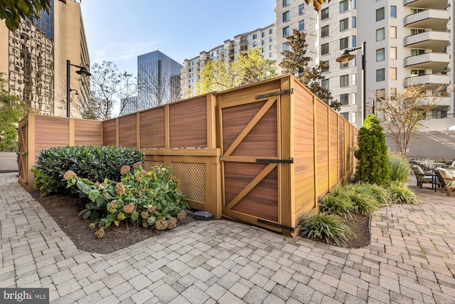 view of outbuilding with a gate and fence