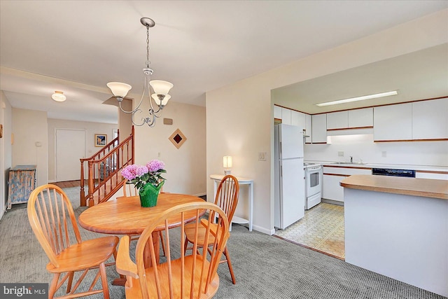 114 Dew Drop Ct, York, PA 17403 - dining room with a chandelier, stairs, light carpet, and baseboards