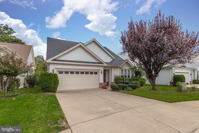 6833 Saddle Run Way, Gainesville, VA 20155 - view of front of home featuring a front lawn, roof with shingles, driveway, brick siding, and a garage