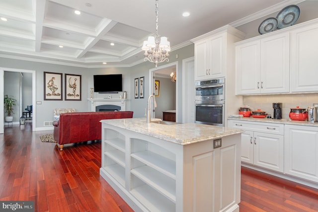 890 Hobart Rd, Hanover, PA 17331 - kitchen featuring a sink, double oven, a chandelier, open floor plan, and white cabinets