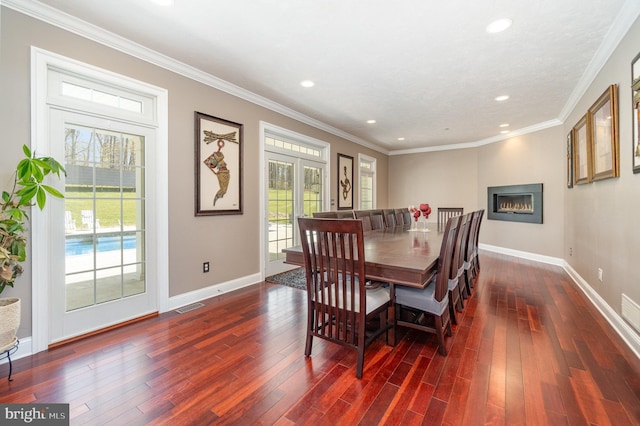 890 Hobart Rd, Hanover, PA 17331 - dining room featuring plenty of natural light, dark wood finished floors, baseboards, recessed lighting, and a glass covered fireplace