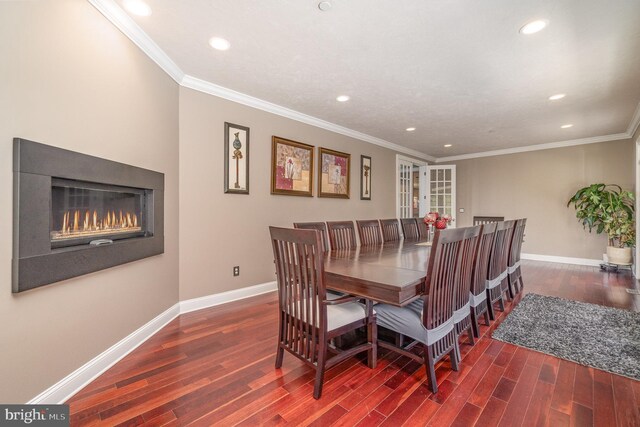 890 Hobart Rd, Hanover, PA 17331 - dining area with wood finished floors, recessed lighting, baseboards, a warm lit fireplace, and crown molding