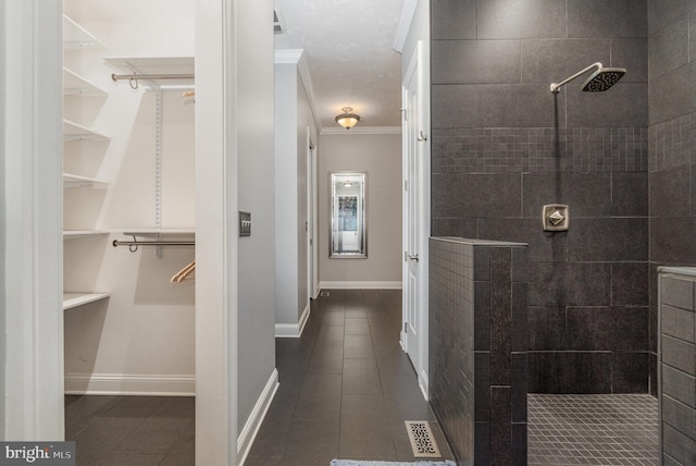 890 Hobart Rd, Hanover, PA 17331 - bathroom featuring tile patterned floors, crown molding, a walk in shower, a walk in closet, and baseboards