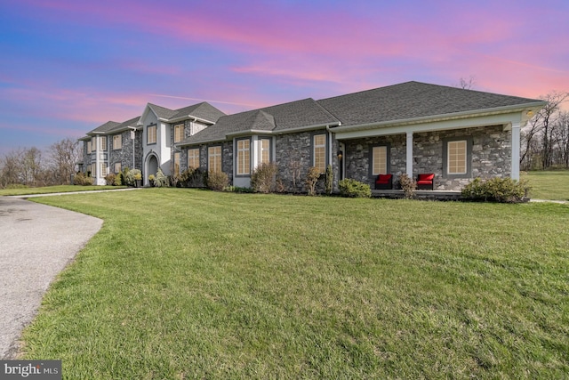 890 Hobart Rd, Hanover, PA 17331 - view of front facade featuring stone siding, a yard, and a shingled roof