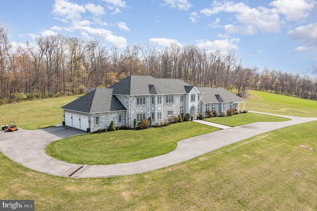 890 Hobart Rd, Hanover, PA 17331 - view of front of property featuring stone siding, asphalt driveway, a front yard, and a garage