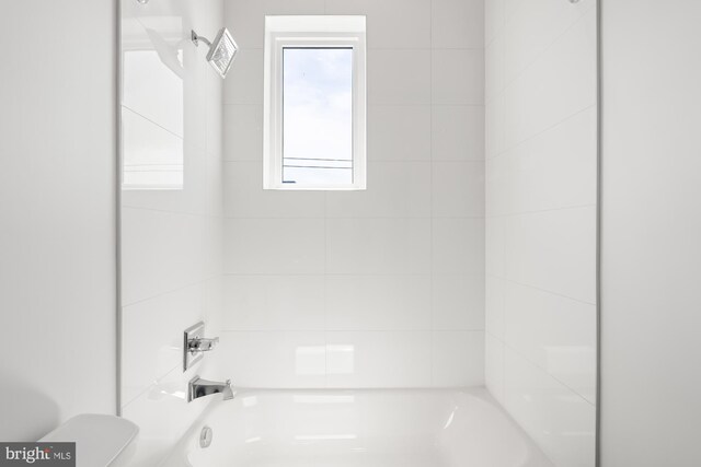 full bathroom with toilet and tub / shower combination