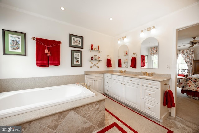 full bath featuring double vanity, ensuite bath, ornamental molding, and a sink