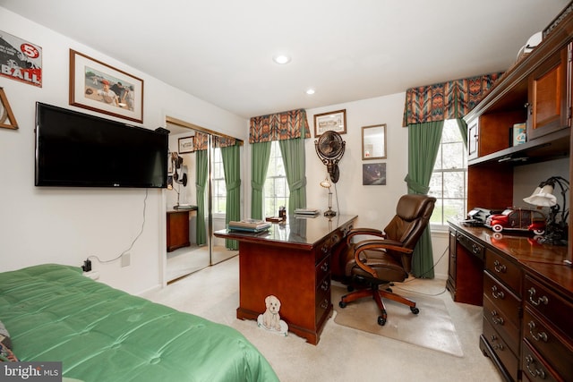 bedroom with light colored carpet and recessed lighting