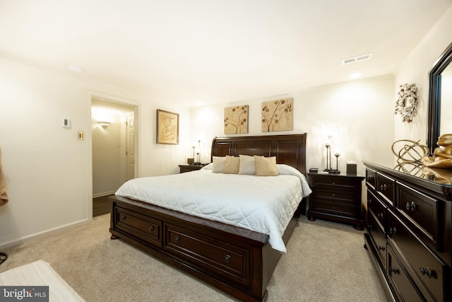 bedroom featuring light colored carpet, baseboards, and visible vents