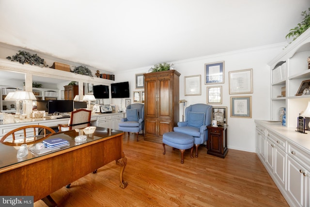office with light wood finished floors and ornamental molding