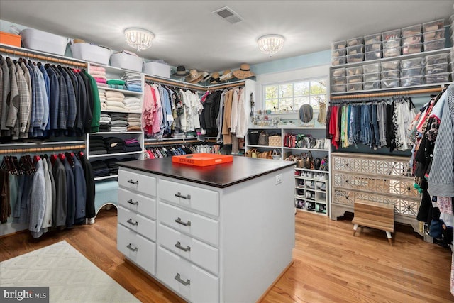 walk in closet with light wood-style flooring and visible vents