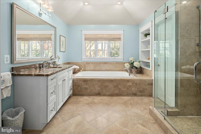 bathroom with vaulted ceiling, plenty of natural light, and a stall shower