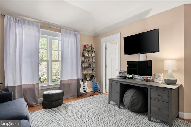 office featuring baseboards and wood finished floors