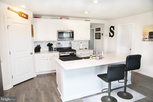 185 Petal Dr, Pottstown, PA 19464 - kitchen featuring white cabinetry, appliances with stainless steel finishes, and dark wood-style flooring