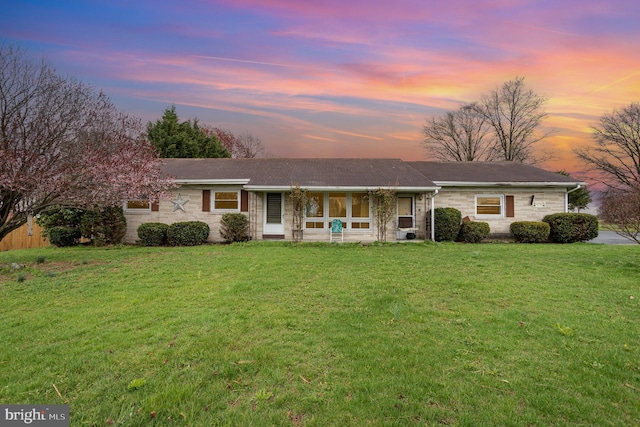 4248 Walters Hatchery Rd, York, PA 17408 - single story home featuring a lawn, stone siding, and a sunroom