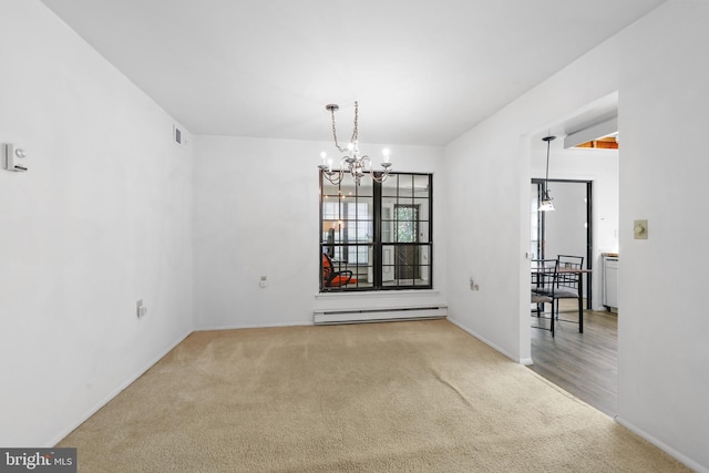 unfurnished dining area with visible vents, a baseboard heating unit, carpet floors, baseboards, and a notable chandelier