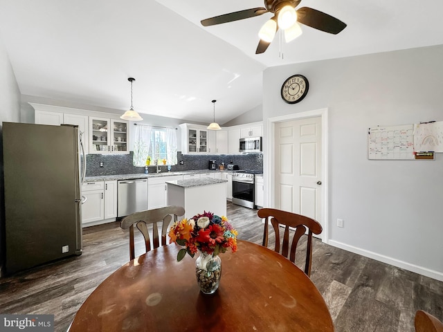 353 Kerrsville Rd, Carlisle, PA 17015 - dining space with vaulted ceiling, baseboards, ceiling fan, and dark wood finished floors