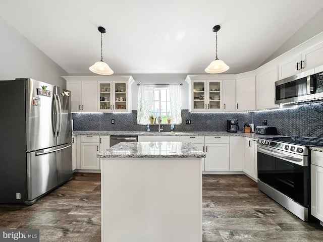 353 Kerrsville Rd, Carlisle, PA 17015 - kitchen with decorative backsplash, vaulted ceiling, stainless steel appliances, and dark wood-style floors
