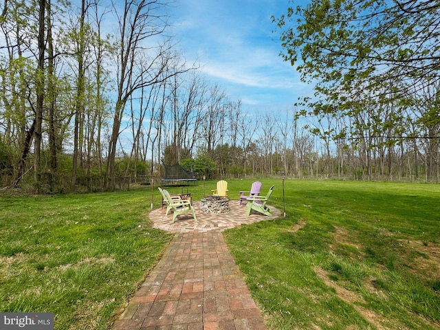 353 Kerrsville Rd, Carlisle, PA 17015 - view of yard with a trampoline, a patio, and an outdoor fire pit