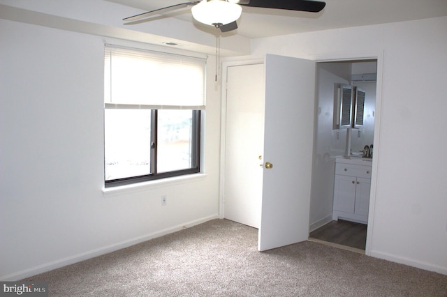 1105 Castle Harbour Way Unit 2B, Glen Burnie, MD 21060 - unfurnished bedroom featuring baseboards, ensuite bath, a sink, and carpet