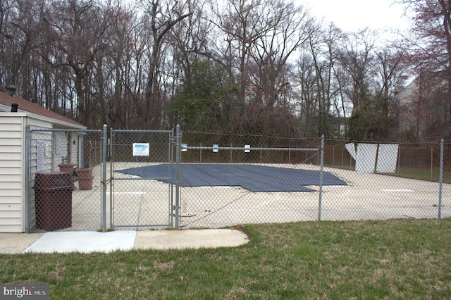 1105 Castle Harbour Way Unit 2B, Glen Burnie, MD 21060 - view of pool with a gate, a yard, and fence