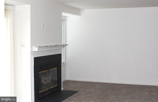 1105 Castle Harbour Way Unit 2B, Glen Burnie, MD 21060 - room details featuring a fireplace with flush hearth, carpet floors, and baseboards
