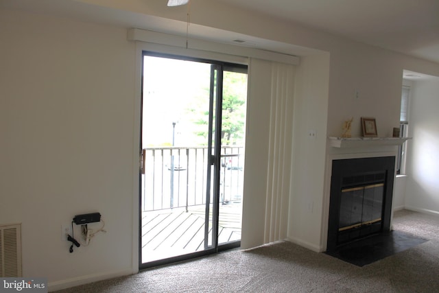 1105 Castle Harbour Way Unit 2B, Glen Burnie, MD 21060 - entryway with a fireplace with flush hearth, baseboards, visible vents, and carpet