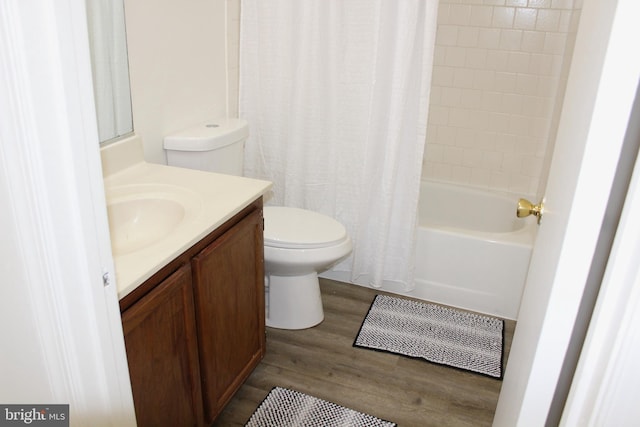 1105 Castle Harbour Way Unit 2B, Glen Burnie, MD 21060 - bathroom with toilet, vanity, wood finished floors, and shower / bath combo with shower curtain