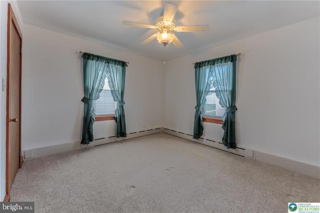 unfurnished room with a ceiling fan and light carpet