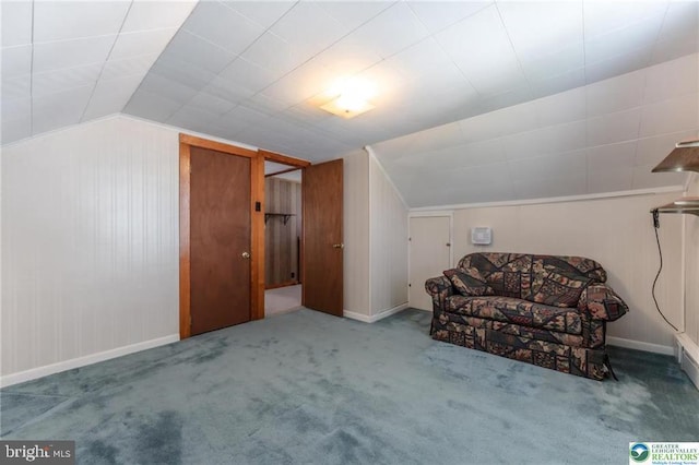bonus room featuring carpet floors, baseboards, and lofted ceiling