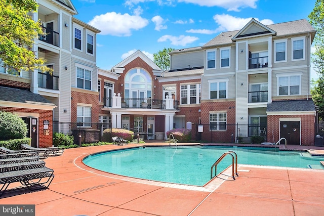 pool with a patio area