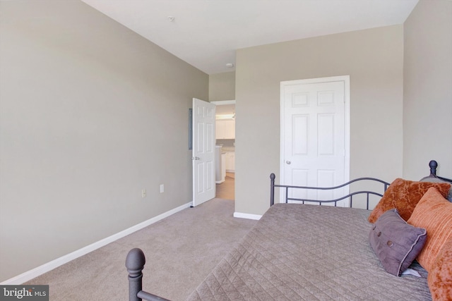 carpeted bedroom with baseboards