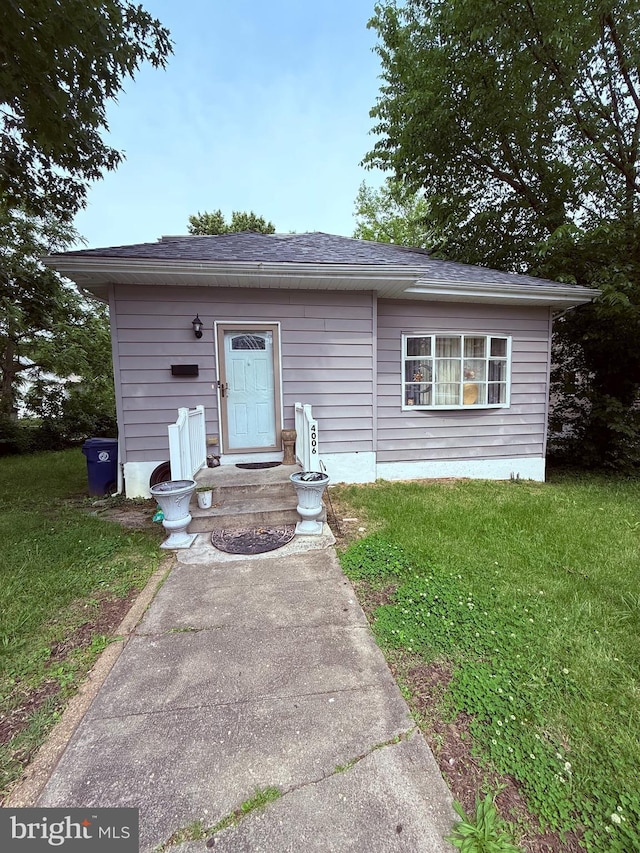 4006 Chesmont Ave, Baltimore, MD 21206 - bungalow-style house with a front lawn and roof with shingles