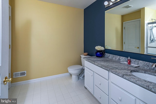 bathroom featuring toilet, baseboards, visible vents, and vanity