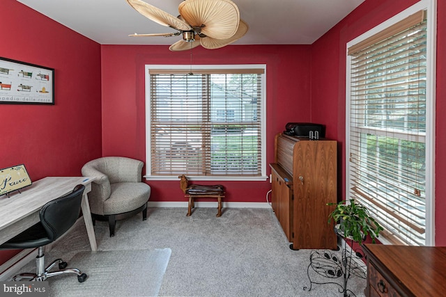 office featuring baseboards, a ceiling fan, and carpet flooring