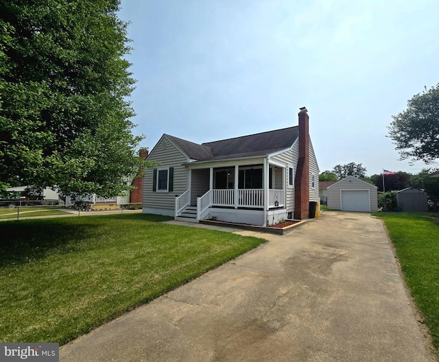 8464 Geneva Rd, Pasadena, MD 21122 - view of front facade featuring a porch, an outdoor structure, a detached garage, a chimney, and concrete driveway