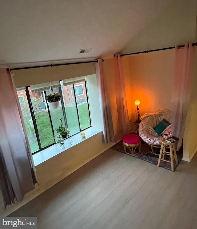living area featuring wood finished floors and baseboards