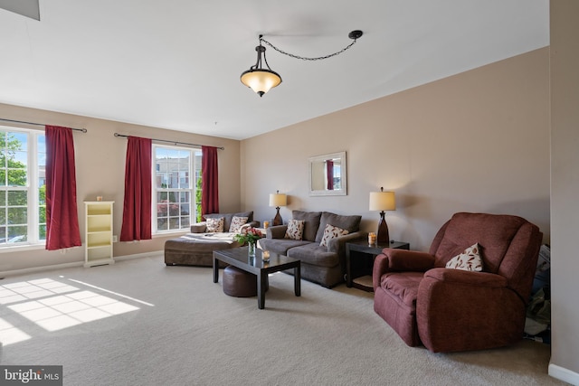 2420 Huntwood Ct, Frederick, MD 21702 - living room featuring carpet floors, a healthy amount of sunlight, and baseboards
