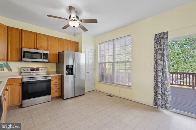 2420 Huntwood Ct, Frederick, MD 21702 - kitchen with stainless steel appliances, light countertops, a wealth of natural light, and ceiling fan