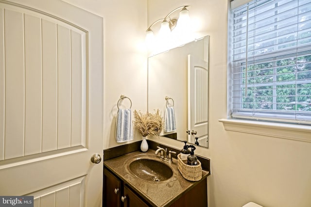 half bathroom with vanity