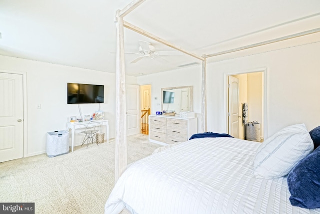 bedroom with a ceiling fan and light carpet