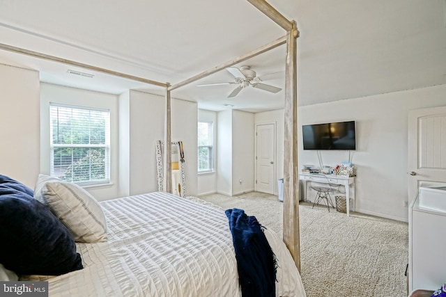 carpeted bedroom featuring visible vents, a ceiling fan, and baseboards