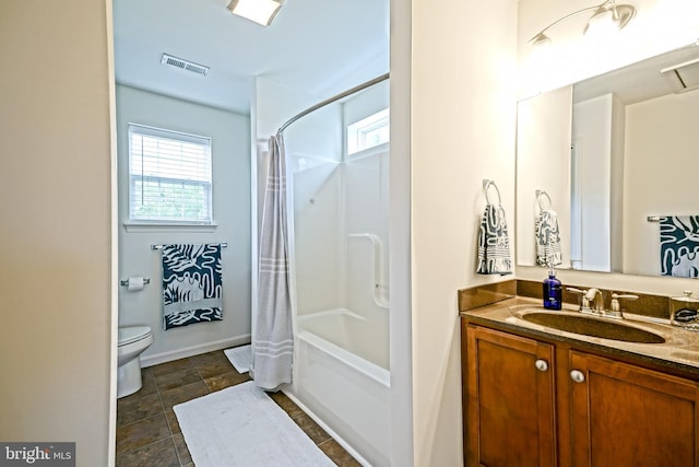 bathroom with visible vents, vanity, toilet, baseboards, and shower / bathtub combination with curtain