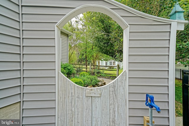 view of gate featuring fence