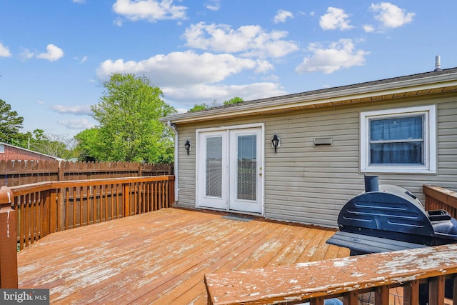 deck featuring a grill and fence