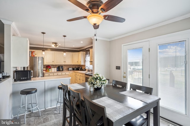 dining area with ceiling fan, recessed lighting, and ornamental molding