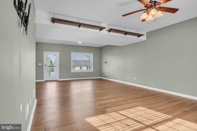 5 Raven Way, Shippensburg, PA 17257 - unfurnished living room with baseboards, a ceiling fan, and wood finished floors