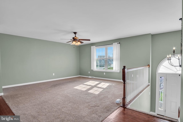 5 Raven Way, Shippensburg, PA 17257 - unfurnished room featuring wood finished floors, carpet flooring, baseboards, and ceiling fan with notable chandelier