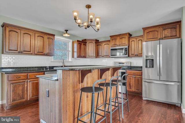 5 Raven Way, Shippensburg, PA 17257 - kitchen featuring backsplash, appliances with stainless steel finishes, and dark wood-style floors